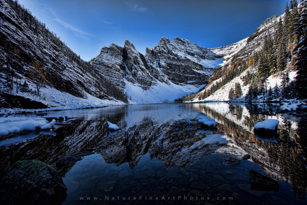 photo of mountain reflection on lake agnes tea house banff