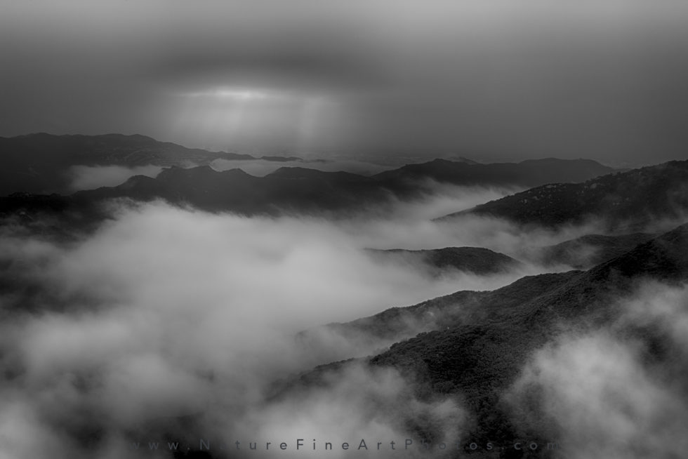 black and white photo of clouds over santa monica mountains